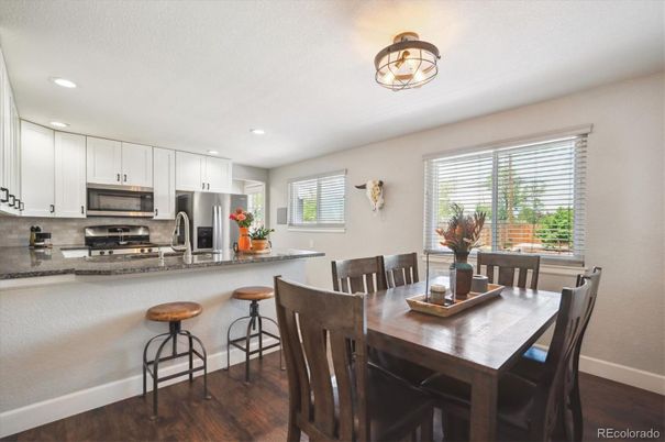Dining room, Interior, Kitchen, Recessed Lighting, Stainless Steel Appliances, Wood Texture Flooring