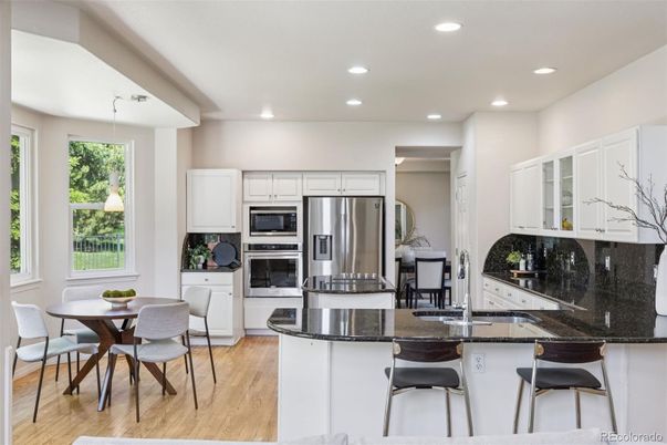 Dining room, Interior, Kitchen, Pendant Lights, Recessed Lighting, Stainless Steel Appliances, Wood Texture Flooring