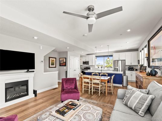 Dining room, Fireplace, Interior, Kitchen, Living room, Pendant Lights, Recessed Lighting, Stainless Steel Appliances, Wood Texture Flooring