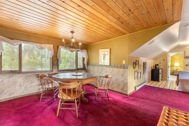 Chandelier, Dining room, Fireplace, Interior, Stone Walls, Wooden Ceilings