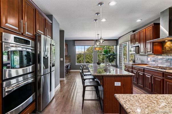 Dining room, Interior, Kitchen, Pendant Lights, Recessed Lighting, Stainless Steel Appliances, Wood Texture Flooring