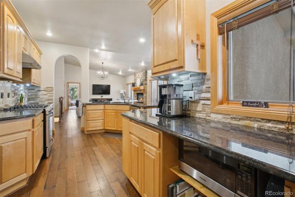Chandelier, Interior, Kitchen, Recessed Lighting, Stainless Steel Appliances, Wood Texture Flooring