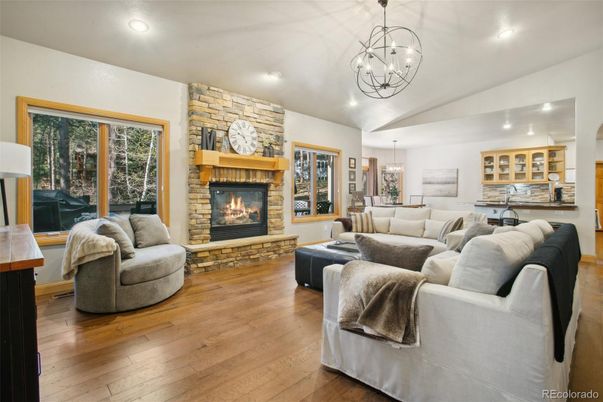 Chandelier, Dining room, Fireplace, Interior, Living room, Pendant Lights, Recessed Lighting, Stone Walls, Wood Texture Flooring