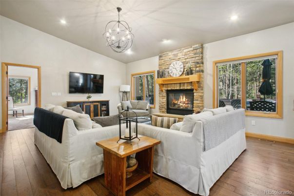 Fireplace, Interior, Living room, Pendant Lights, Recessed Lighting, Stone Walls, Wood Texture Flooring