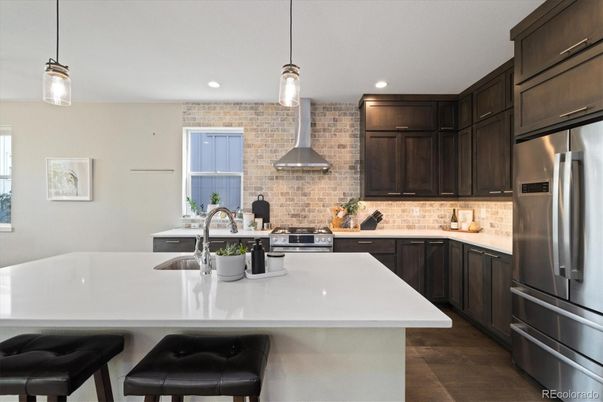 Interior, Kitchen, Pendant Lights, Recessed Lighting, Stainless Steel Appliances, Stone Walls, Wood Texture Flooring