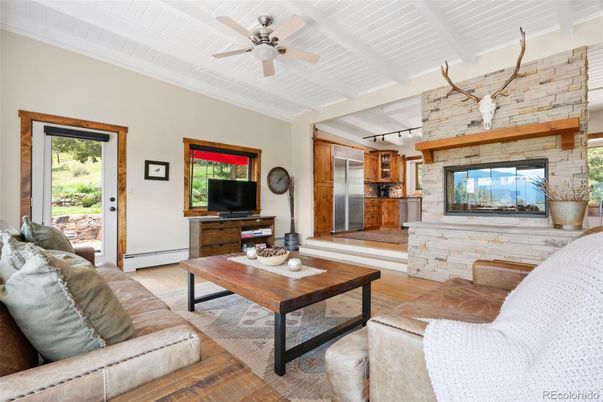 Fireplace, Interior, Kitchen, Living room, Stainless Steel Appliances, Stone Walls, Wood Texture Flooring