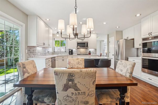 Dining room, Interior, Kitchen, Pendant Lights, Recessed Lighting, Stainless Steel Appliances, Wood Texture Flooring