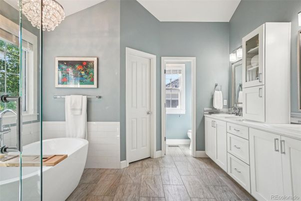 Bathroom, Chandelier, Dual Sink Vanities, Free Standing Baths, Interior, Wood Texture Flooring