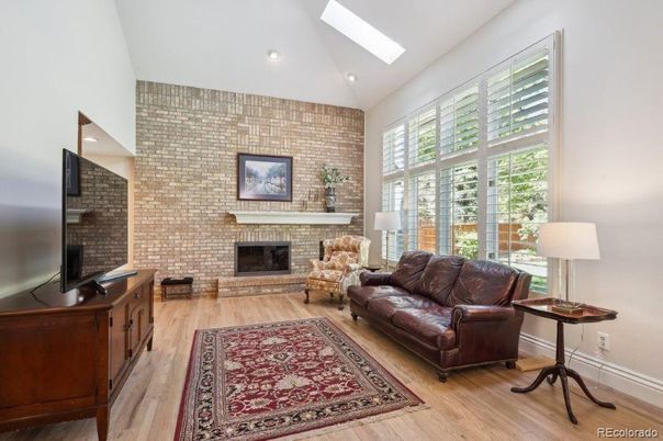 Fireplace, Interior, Living room, Recessed Lighting, Stone Walls, Wood Texture Flooring