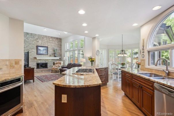 Dining room, Fireplace, Interior, Kitchen, Living room, Pendant Lights, Recessed Lighting, Stainless Steel Appliances, Stone Walls, Wood Texture Flooring