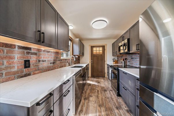 Interior, Kitchen, Stainless Steel Appliances, Stone Walls, Wood Texture Flooring
