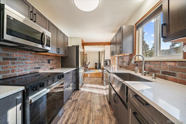 Interior, Kitchen, Stainless Steel Appliances, Stone Walls, Wood Texture Flooring