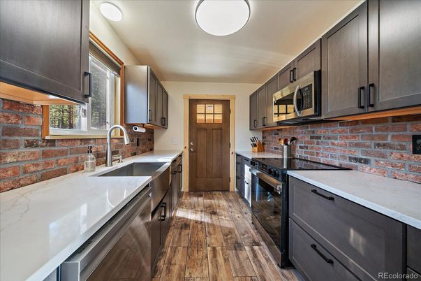 Interior, Kitchen, Stainless Steel Appliances, Stone Walls, Wood Texture Flooring