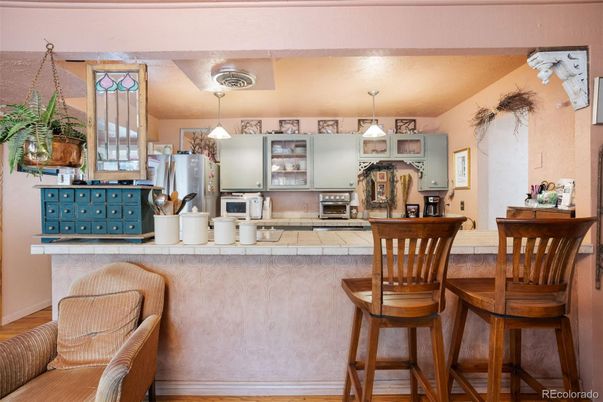 Interior, Kitchen, Pendant Lights, Tile Countertops, Wood Texture Flooring