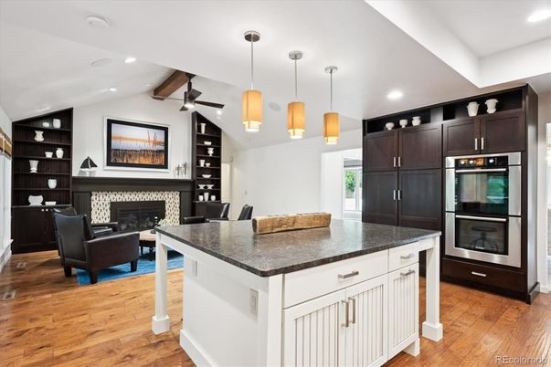 Fireplace, Interior, Kitchen, Living room, Pendant Lights, Recessed Lighting, Stainless Steel Appliances, Wood Texture Flooring