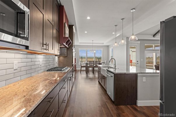 Chandelier, Dining room, Interior, Kitchen, Pendant Lights, Recessed Lighting, Stainless Steel Appliances, Wood Texture Flooring