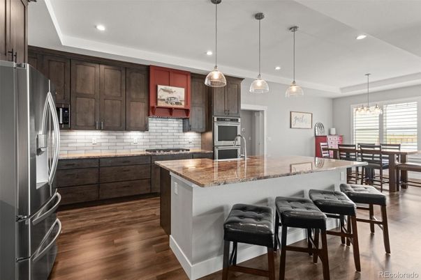 Chandelier, Dining room, Interior, Kitchen, Pendant Lights, Recessed Lighting, Stainless Steel Appliances, Wood Texture Flooring