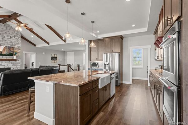 Interior, Kitchen, Living room, Pendant Lights, Recessed Lighting, Stainless Steel Appliances, Stone Walls, Wood Texture Flooring