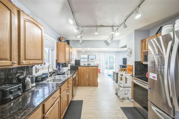 Interior, Kitchen, Stainless Steel Appliances, Tile Countertops, Wood Texture Flooring