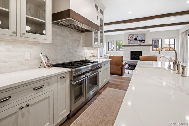Fireplace, Interior, Kitchen, Recessed Lighting, Stainless Steel Appliances, Stone Walls, Wooden Beams, Wood Texture Flooring