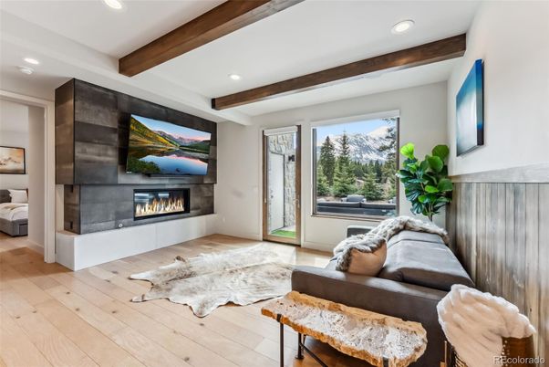 Bedroom, Fireplace, Interior, Living room, Recessed Lighting, Wooden Beams, Wood Texture Flooring
