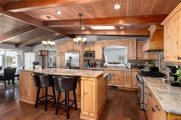 Chandelier, Dining room, Interior, Kitchen, Pendant Lights, Recessed Lighting, Stainless Steel Appliances, Wooden Beams, Wooden Ceilings, Wood Texture Flooring