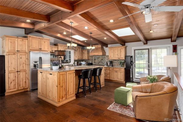 Chandelier, Interior, Kitchen, Living room, Pendant Lights, Recessed Lighting, Stainless Steel Appliances, Wooden Beams, Wooden Ceilings, Wood Texture Flooring