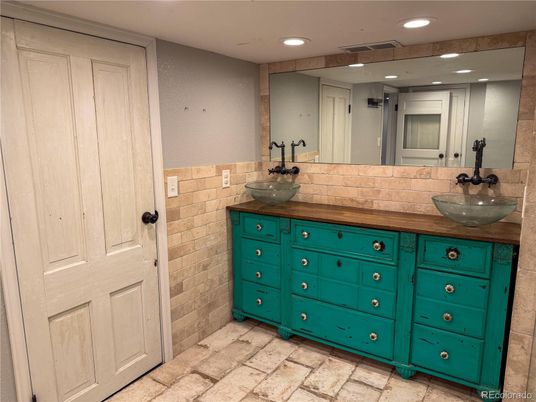 Bathroom, Dual Sink Vanities, Interior, Recessed Lighting, Stone Walls