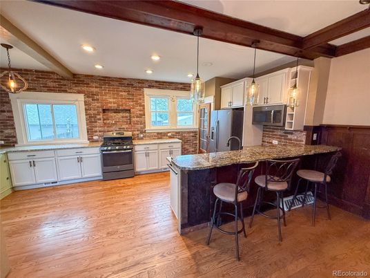 Interior, Kitchen, Pendant Lights, Recessed Lighting, Stainless Steel Appliances, Stone Walls, Wooden Beams, Wood Texture Flooring