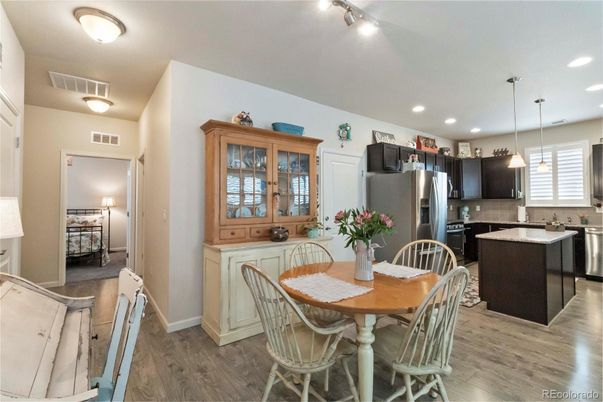 Dining room, Interior, Kitchen, Pendant Lights, Recessed Lighting, Stainless Steel Appliances, Wood Texture Flooring