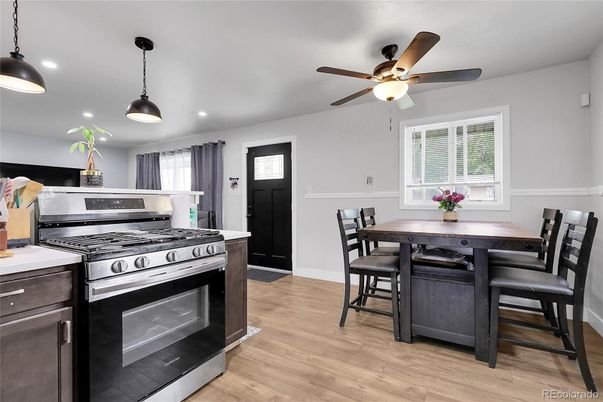 Dining room, Interior, Kitchen, Pendant Lights, Recessed Lighting, Stainless Steel Appliances, Wood Texture Flooring
