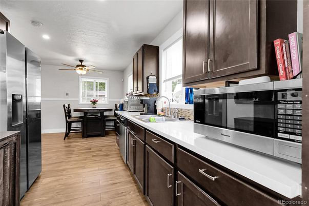 Dining room, Interior, Kitchen, Recessed Lighting, Stainless Steel Appliances, Wood Texture Flooring
