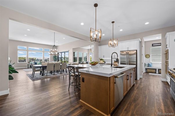 Chandelier, Dining room, Interior, Kitchen, Pendant Lights, Recessed Lighting, Stainless Steel Appliances, Wood Texture Flooring