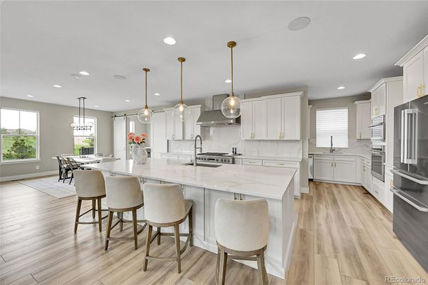 Dining room, Interior, Kitchen, Pendant Lights, Recessed Lighting, Stainless Steel Appliances, Wood Texture Flooring