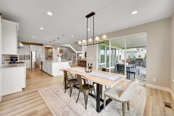 Dining room, Interior, Kitchen, Pendant Lights, Recessed Lighting, Stainless Steel Appliances, Wood Texture Flooring