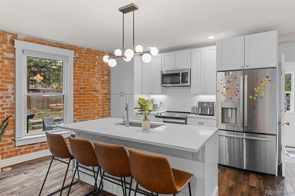 Interior, Kitchen, Pendant Lights, Recessed Lighting, Stainless Steel Appliances, Stone Walls, Wood Texture Flooring