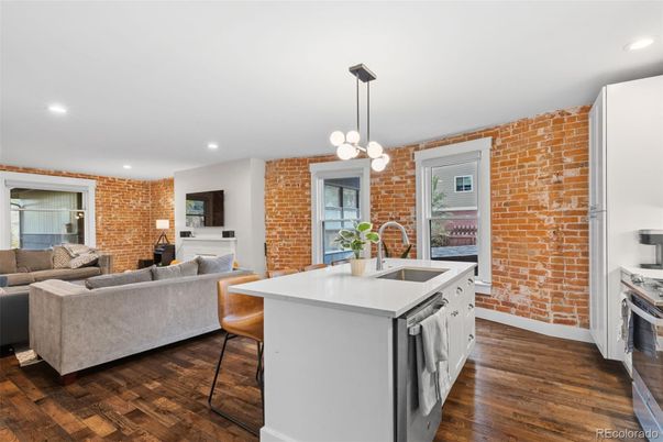 Interior, Kitchen, Living room, Pendant Lights, Recessed Lighting, Stainless Steel Appliances, Stone Walls, Wood Texture Flooring