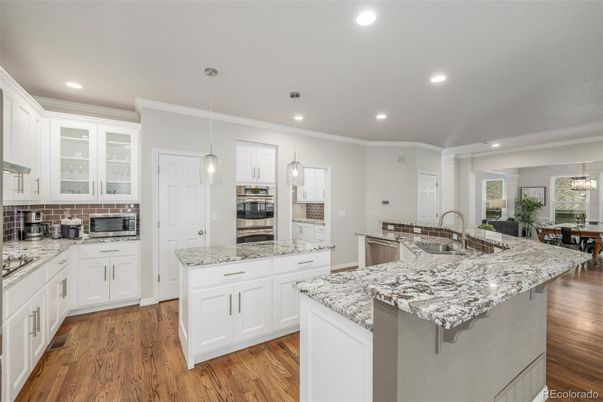 Dining room, Interior, Kitchen, Pendant Lights, Recessed Lighting, Stainless Steel Appliances, Wood Texture Flooring
