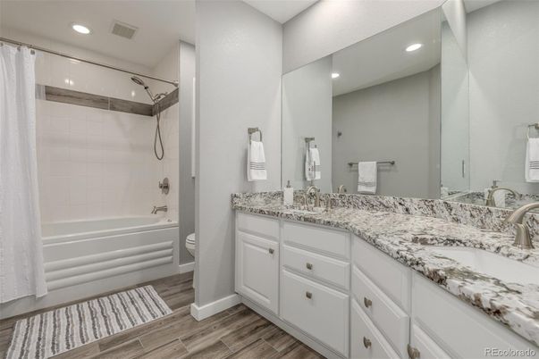 Bathroom, Dual Sink Vanities, Interior, Recessed Lighting, Wood Texture Flooring