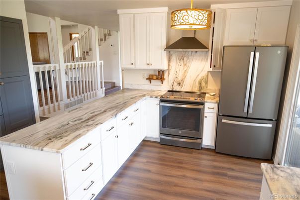 Interior, Kitchen, Marble Walls, Stainless Steel Appliances, Wood Texture Flooring
