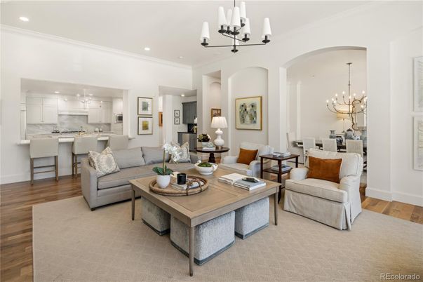 Chandelier, Dining room, Interior, Kitchen, Living room, Pendant Lights, Recessed Lighting, Stainless Steel Appliances, Wood Texture Flooring