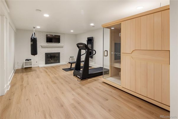 Fireplace, Fitness Equipment, Interior, Recessed Lighting, Wood Texture Flooring