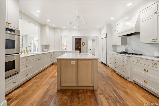 Interior, Kitchen, Marble Walls, Recessed Lighting, Stainless Steel Appliances, Wood Texture Flooring