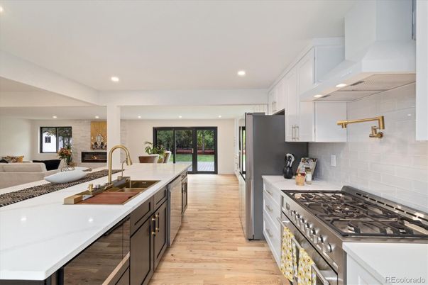 Fireplace, Interior, Kitchen, Living room, Recessed Lighting, Stainless Steel Appliances, Wood Texture Flooring