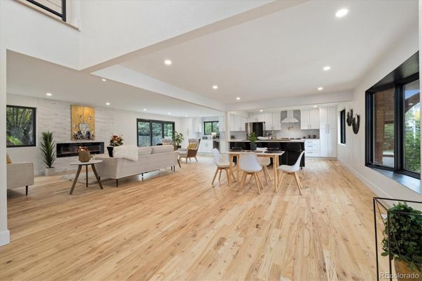 Dining room, Fireplace, Interior, Kitchen, Living room, Recessed Lighting, Stainless Steel Appliances, Stone Walls, Wood Texture Flooring