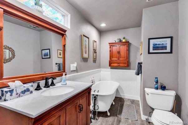 Bathroom, Dual Sink Vanities, Free Standing Baths, Interior, Recessed Lighting, Wood Texture Flooring