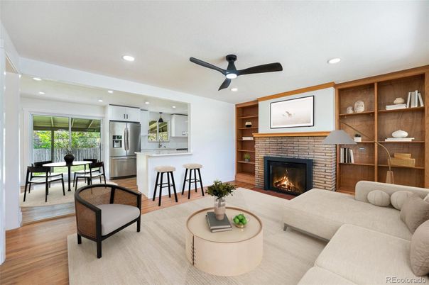 Dining room, Fireplace, Interior, Kitchen, Living room, Recessed Lighting, Stainless Steel Appliances, Wood Texture Flooring