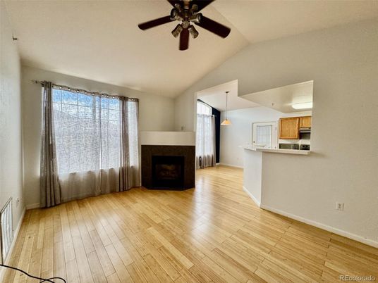 Empty room, Fireplace, Interior, Kitchen, Pendant Lights, Wood Texture Flooring