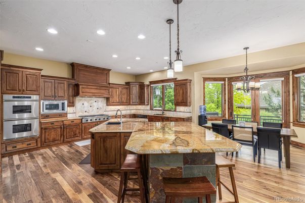 Dining room, Interior, Kitchen, Pendant Lights, Recessed Lighting, Stainless Steel Appliances, Wood Texture Flooring