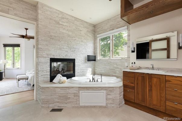 Bathroom, Dual Sink Vanities, Fireplace, Interior, Recessed Lighting, Stone Walls